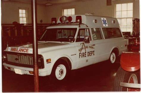 An Ambulance Is Parked In A Building With Fire Department Signs On The