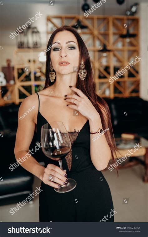 Woman With Red Wine In A Wine Glass In Wine Restaurant Lady Wearing In Black Business Women