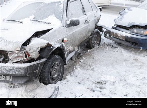 Two Crashed Cars In Accident On Winter Road With Snow Stock Photo Alamy