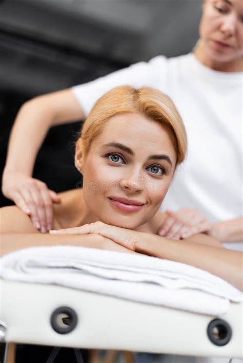 Blurred Masseur Doing Shoulder Massage To Stock Image Image Of Client