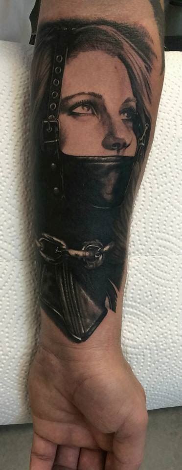 Black And Grey Bdsm Tattoo On The Inner Forearm