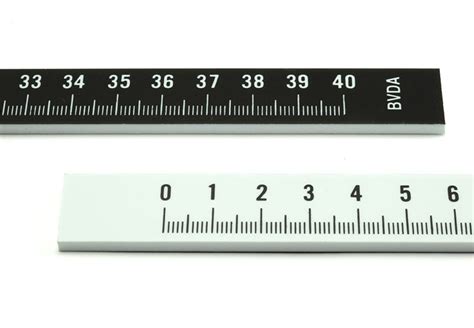 Converter of inch to millimetre, formula and table of conversion of in in mm. Photo ruler with cm and mm markings, 40 cm in length ...