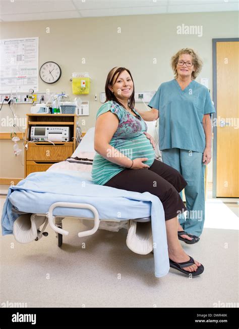 Happy Nurse With Pregnant Woman In Hospital Room Stock Photo 67505779