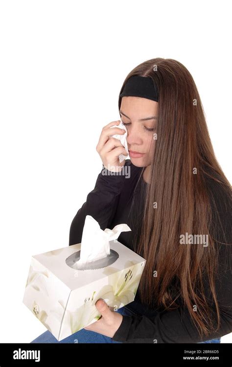 A Beautiful Young Teen Girl Crying With A Tissue In Her Hand Wiping The Tears Of And Holding