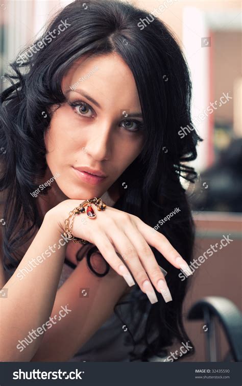 Portrait Of Attractive Girl With Beautiful Hairstyle And Long Nails