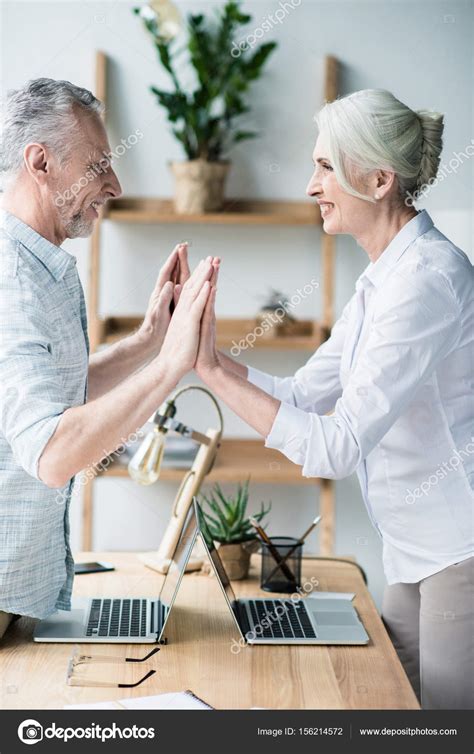 People Giving Double High Five — Stock Photo © Arturverkhovetskiy