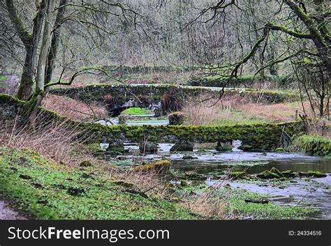 Moss Covered Bridges Over A Small River Free Stock Images And Photos