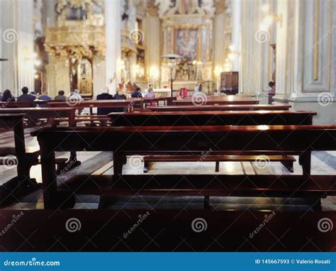 Wooden Benches To Sit Inside A Baroque Catholic Church During The