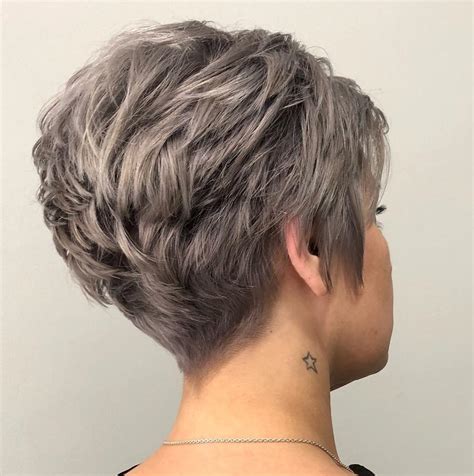 The back is tapered into the nape for a sharp and neat finish.the fabulous pixie has many. Feathered Pixie Hair Styles - Wavy Haircut