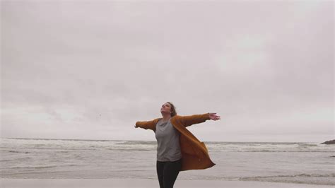 Joyful Girl With Lifted Arms At The Beach Filmpac