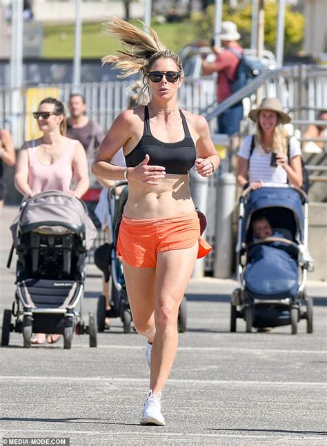 Candice Warner Shows Off Her Fit Figure In A Crop Top And Tiny Shorts