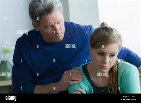 Father Comforting Teenage Daughter Stock Photo Alamy