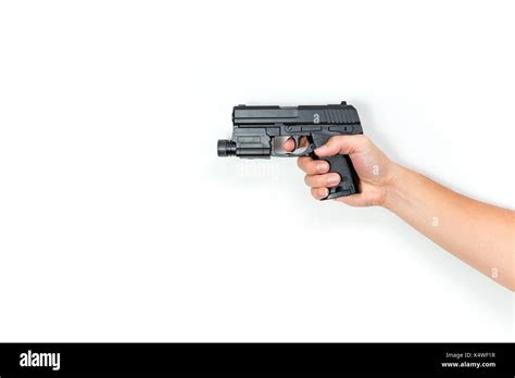 Male Hand Hold Pistol Gun Or Automatic Handgun From Side Isolated On