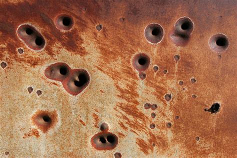 Rusty Bullet Hole Background Stock Photos Pictures And Royalty Free