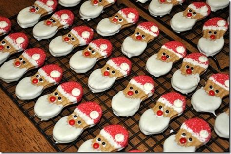 Dip in white bark, decorate with mini m&m's for buttons, black fine line icing tube for mouth. Nutter Butter Cookies Decorated For Christmas : Nutter ...