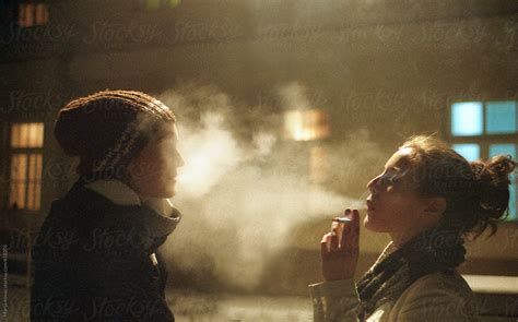 Two Girls Blowing Cigarette Smoke In Each Other Face By Marija Kovac