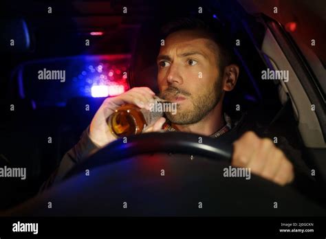 Police Stopped Car With Drunk Driver Inside Drunk Man Drinking Alcohol While Driving Car