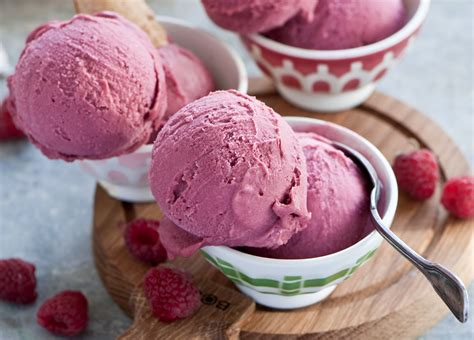 Strawberry Flavored Ice Creams On White Ceramic Bowls With Stainless