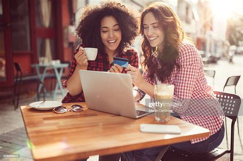 Girls Drinking Coffee And Shopping Online Photo Getty Images