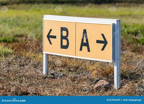 Yellow And Black Airport Direction Signs Pointing Taxiways Stock Image