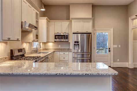 Shaker crown molding in dove gray. White Shaker Cabinets - Kitchen Photo Gallery