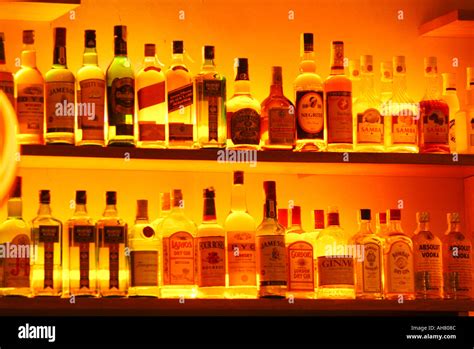 Backlit Liquor Bottles On Shelf Behind A Bar Stock Photo Alamy