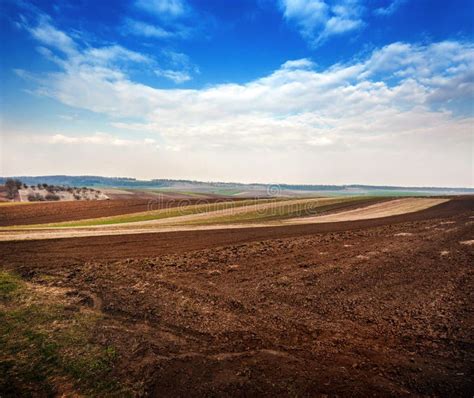 Spring Field Soil And Hills Landscape In The Background Stock Image
