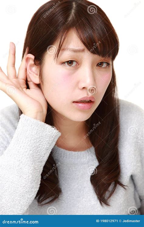 Young Japanese Woman With Hand Behind Ear Listening Closely Stock Image Image Of Adult