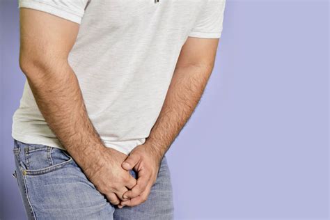 A Man With Hands Holding His Crotch Man Feels Pain In His Groin