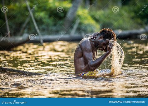 asmat man is bathing in the river editorial photography image of healthy guinea 82209962