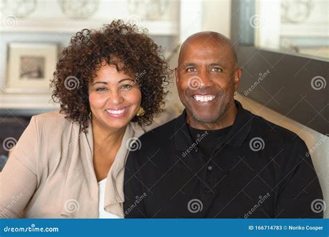 Portrait Of A Mature Mixed Race Couple Smiling Stock Image Image Of Wife Cheerful 166714783