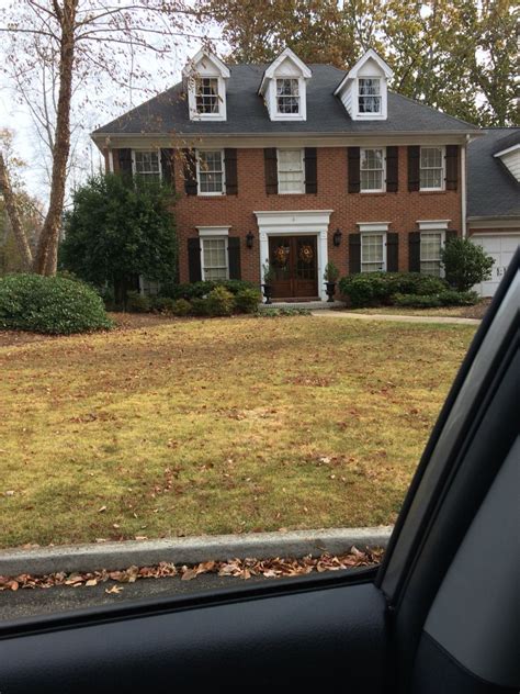 A white bathroom looks clean, crisp and bright. Wood shutters on red brick house with white accents | Home ...