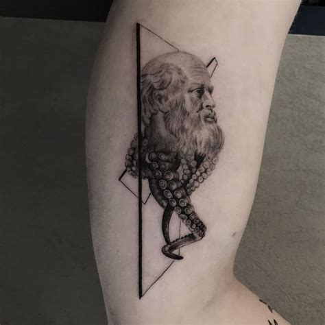 A Man With A Beard And An Octopus Tattoo On His Leg