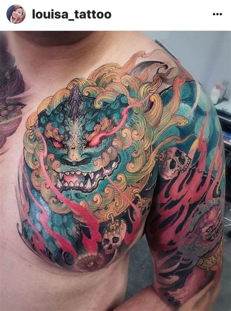 A Man With A Dragon Tattoo On His Chest