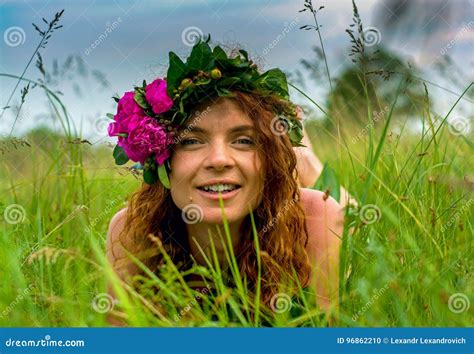 Pretty Young Forest Nymph Laying In The Grass Royalty Free Stock Image