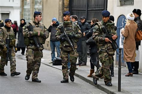 Charlie Hebdo Attack French And German Police Arrest At Least 14 Thought To Have Ties To Isis