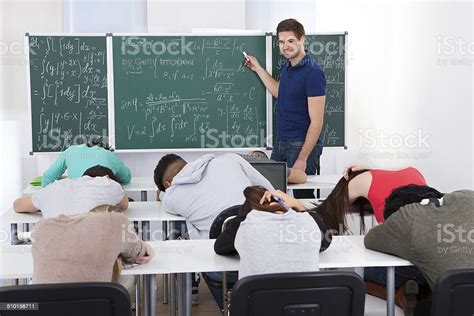 Teacher Teaching Mathematics To Bored Students Stock Photo Download