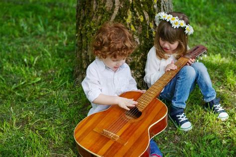Cute Children Playing Guitar Stock Image Image Of Park Childhood