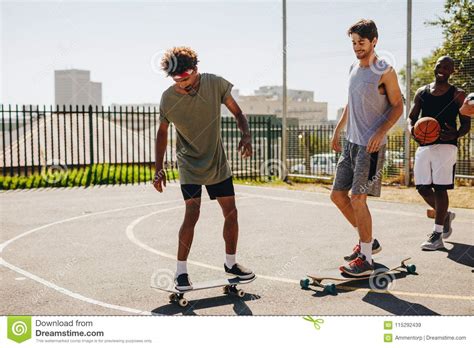 Basketball Players Skating On Skateboard Stock Image Image Of Game
