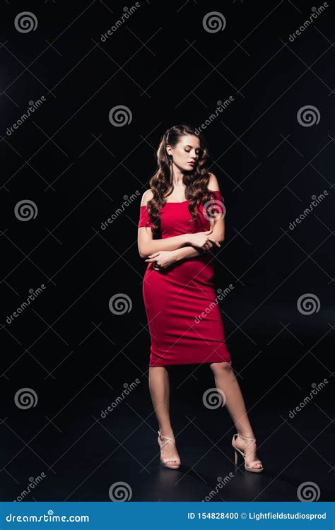 Attractive Woman In Red Dress Posing With Arms Crossed Isolated Stock