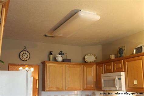 The cabinets are maple with a brown mahogany stain. Texas Decor: A New Kitchen Light