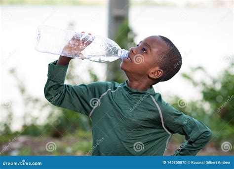 Child Drinking Bottled Water In Nature Stock Photo Image Of Plastic