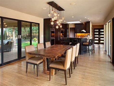 The lights hanging down have the look of lanterns with open bottoms. Track Lighting Over Dining Table | F Wall Decoration