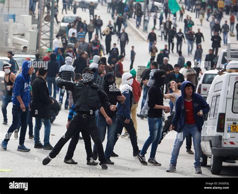 Palestinian Hamas Supporters Throw Stones During Clashes With Israeli