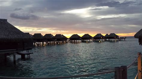 Sunset Over The Over Water Bungalows At The Hilton Moorea