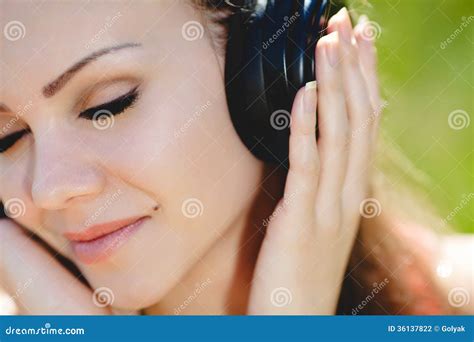 Beautiful Young Woman Listen To Music Wearing Headphones Outdoors Stock