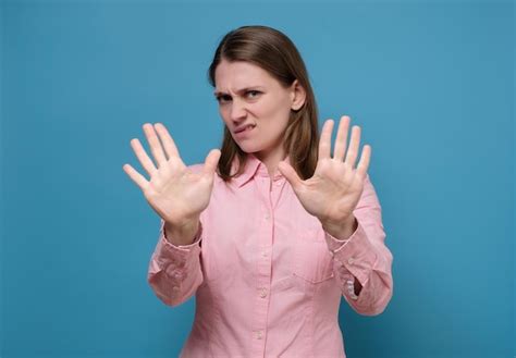 Premium Photo Woman Showing Stop Gesture With Her Hand