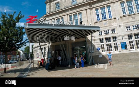 View Of People At Entrance Sign And Logo To Swansea Train Station