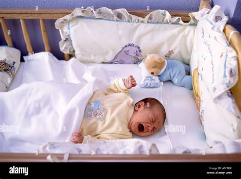 Small Baby Crying In Crib Stock Photo 9976110 Alamy