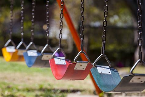Empty Colorful Swings At The Park X Community Advocates For Family Youth